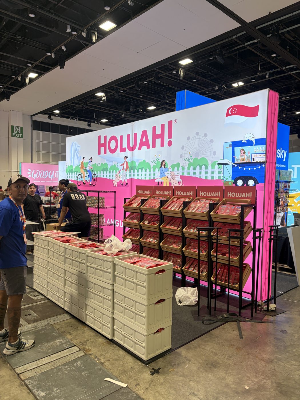 Holuah exhibition booth with backlit lightbox wall