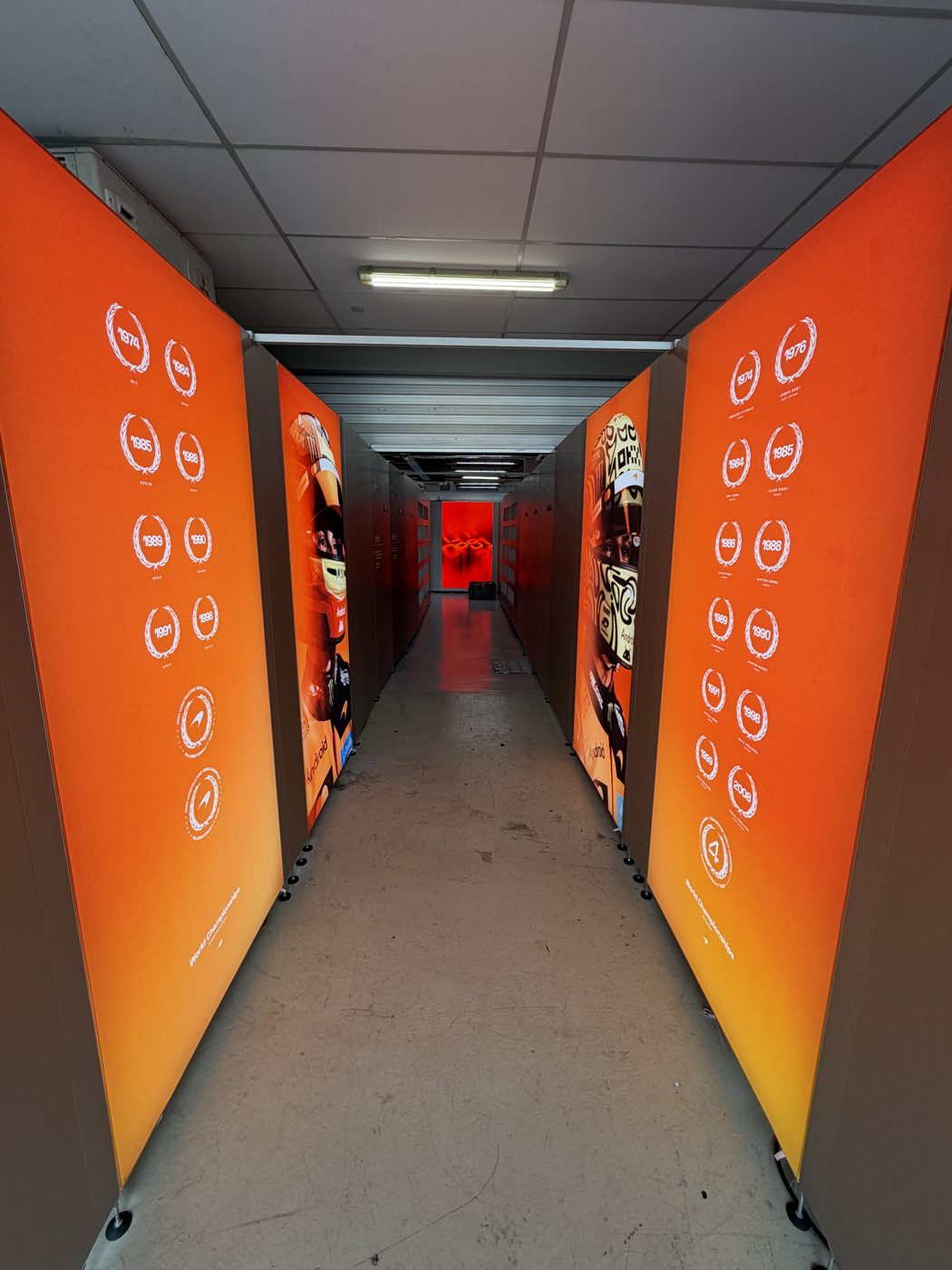 McLaren orange backlit lightbox corridor