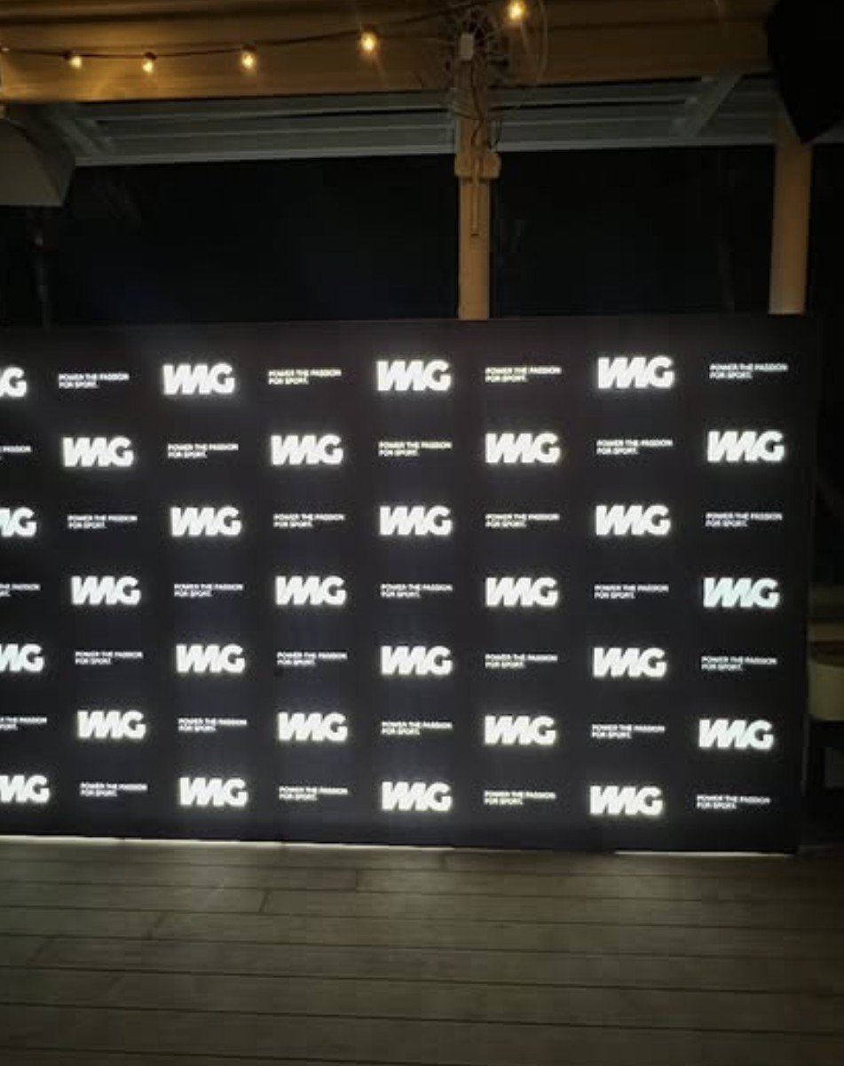 WMG backlit step-and-repeat wall